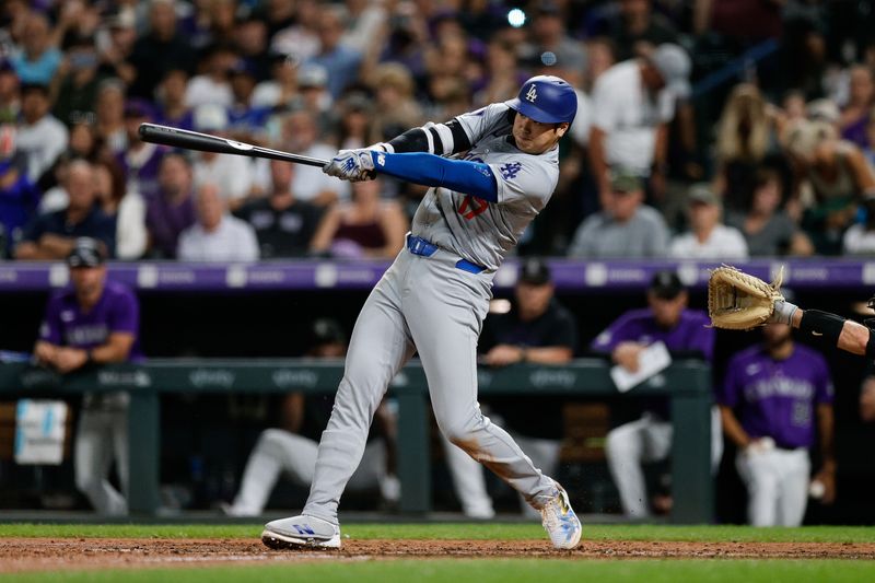 Sep 27, 2024; Denver, Colorado, USA; Los Angeles Dodgers designated hitter Shohei Ohtani (17) hits a three run home run in the sixth inning against the Colorado Rockies at Coors Field. Mandatory Credit: Isaiah J. Downing-Imagn Images