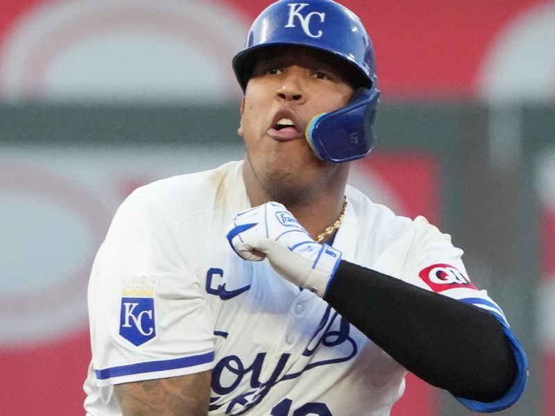 May 7, 2024; Kansas City, Missouri, USA; Kansas City Royals catcher Salvador Perez (13) celebrates on second base after hitting a two-run double against the Milwaukee Brewers in the fifth inning at Kauffman Stadium. Mandatory Credit: Denny Medley-USA TODAY Sports