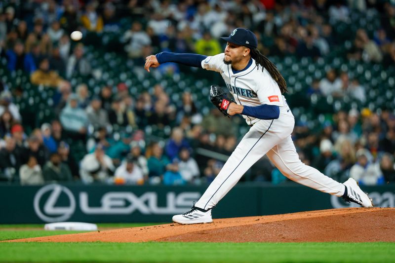 Apr 8, 2025; Seattle, Washington, USA; Seattle Mariners starting pitcher Luis Castillo (58) throws against the Houston Astros during the first inning at T-Mobile Park. Mandatory Credit: Joe Nicholson-Imagn Images