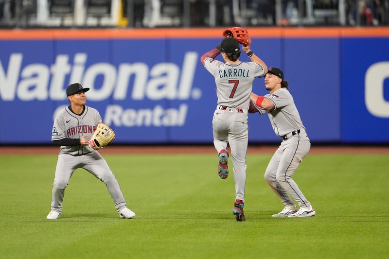 Apr 30, 2025; New York City, New York, USA; Arizona Diamondbacks left fielder Jorge Barrosa (1) and right fielder Corbin Carroll (7) and center fielder Alek Thomas (5) celebrate the victory against the New York Mets after the ninth inning at Citi Field. Mandatory Credit: Gregory Fisher-Imagn Images