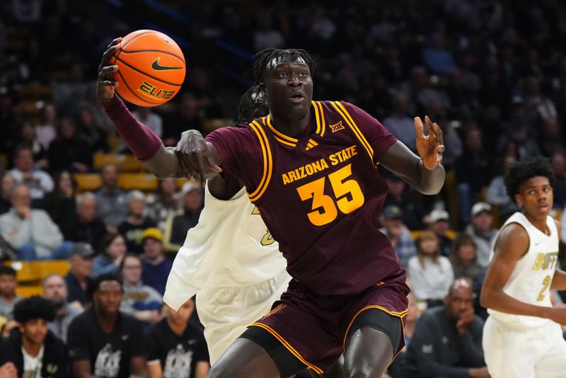 Feb 7, 2026; Boulder, Colorado, USA; Colorado Buffaloes forward Bangot Dak (8) fouls Arizona State Sun Devils center Massamba Diop (35) in the first half at the CU Events Center. Mandatory Credit: Ron Chenoy-Imagn Images