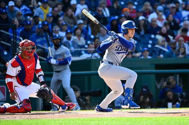 Apr 9, 2025; Washington, District of Columbia, USA; Los Angeles Dodgers outfielder Tommy Edman (25) hits a two run RBI triple against the Washington Nationals during the first inning at Nationals Park. Mandatory Credit: Brad Mills-Imagn Images