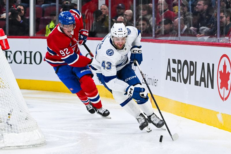 Jan 21, 2025; Montreal, Quebec, CAN; Tampa Bay Lightning defenseman Darren Raddysh (43) defends the puck against Montreal Canadiens right wing Patrik Laine (92) during the third period at Bell Centre. Mandatory Credit: David Kirouac-Imagn Images