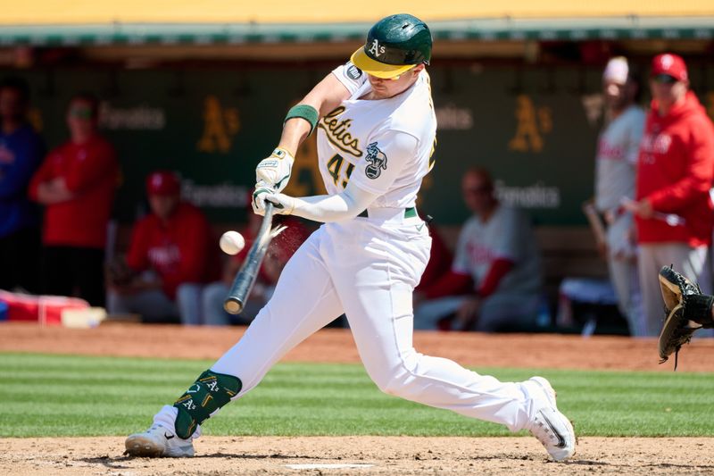 Jun 17, 2023; Oakland, California, USA; Oakland Athletics infielder Ryan Noda (49) hits a single and breaks his bat against the Philadelphia Phillies during the eighth inning at Oakland-Alameda County Coliseum. Mandatory Credit: Robert Edwards-USA TODAY Sports