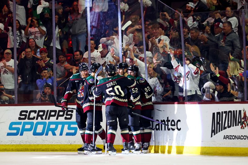 Apr 17, 2024; Tempe, Arizona, USA; The Arizona Coyotes celebrate a goal by left wing Lawson Crouse (67) during the third period against the Edmonton Oilers at Mullett Arena. Mandatory Credit: Mark J. Rebilas-USA TODAY Sports