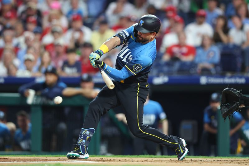 Sep 26, 2025; Philadelphia, Pennsylvania, USA; Philadelphia Phillies outfielder Kyle Schwarber (12) hits an infield single during the first inning against the Minnesota Twins at Citizens Bank Park. Mandatory Credit: Bill Streicher-Imagn Images