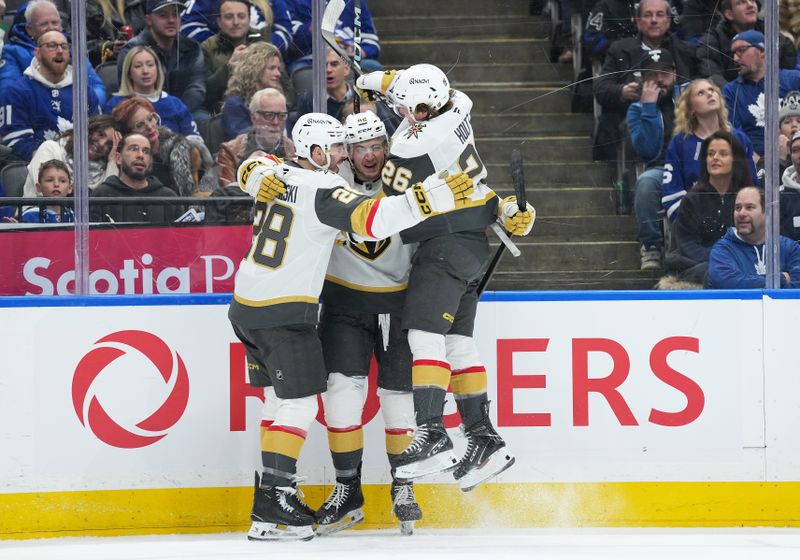 Jan 23, 2026; Toronto, Ontario, CAN; Vegas Golden Knights right wing Braeden Bowman (42) scores a goal and celebrates with right wing Alexander Holtz (26) against the Toronto Maple Leafs during the second period at Scotiabank Arena. Mandatory Credit: Nick Turchiaro-Imagn Images