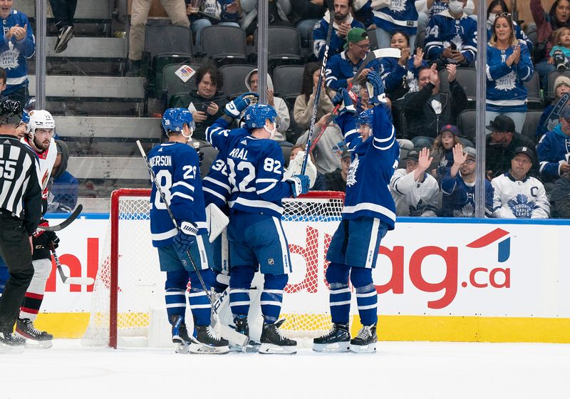 Sep 24, 2022; Toronto, Ontario, CAN; Toronto Maple Leafs center Fraser Minten (39) celebrates the win with Toronto Maple Leafs defenseman Filip Kral (82) against the Ottawa Senators at the end of the third period at Scotiabank Arena. Mandatory Credit: Nick Turchiaro-USA TODAY Sports