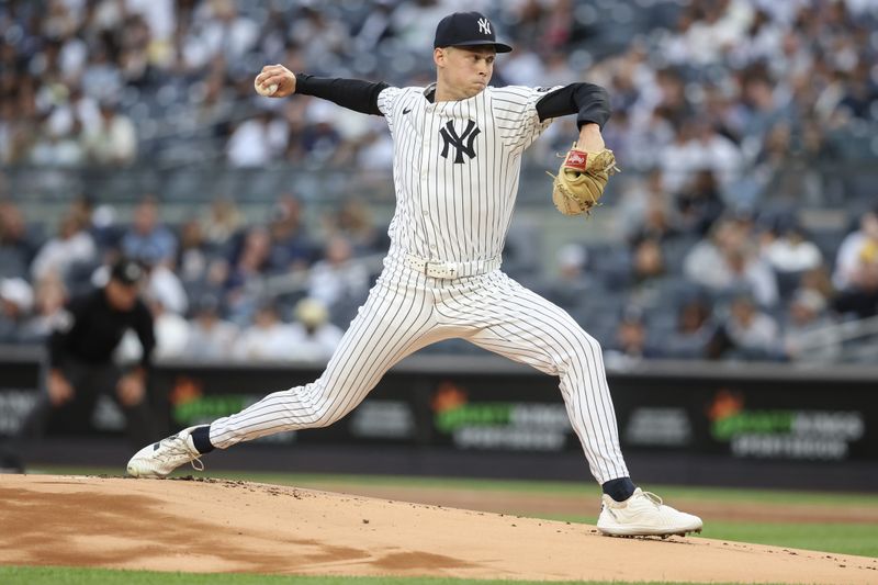 Jun 27, 2025; Bronx, New York, USA;  New York Yankees starting pitcher Will Warren (98) pitches in the first inning against the Athletics at Yankee Stadium. Mandatory Credit: Wendell Cruz-Imagn Images
