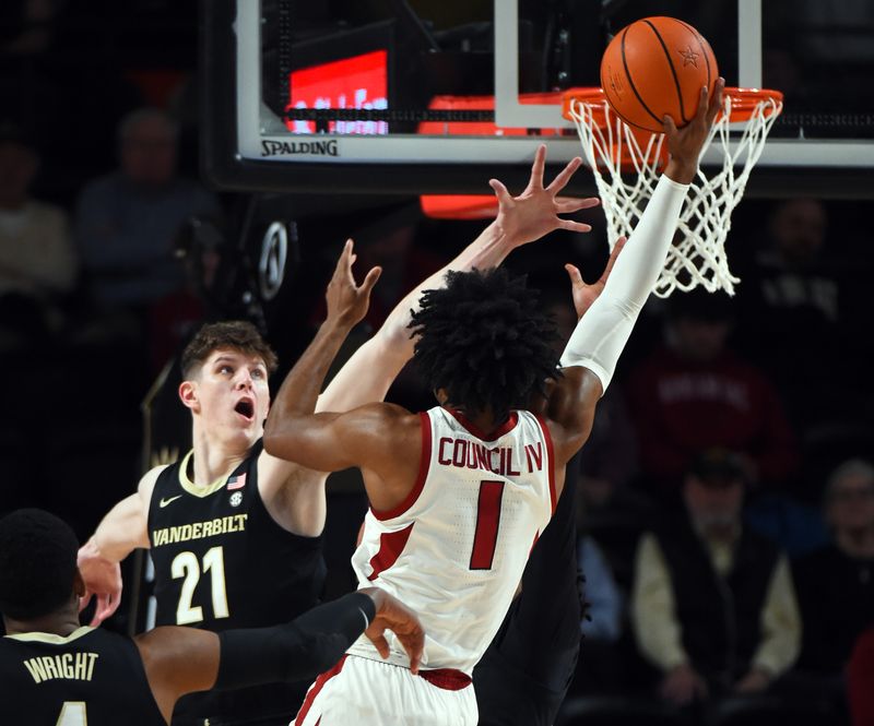 Jan 14, 2023; Nashville, Tennessee, USA; Arkansas Razorbacks guard Ricky Council IV (1) is fouled shooting against Vanderbilt Commodores forward Liam Robbins (21) during the first half at Memorial Gymnasium. Mandatory Credit: Christopher Hanewinckel-USA TODAY Sports