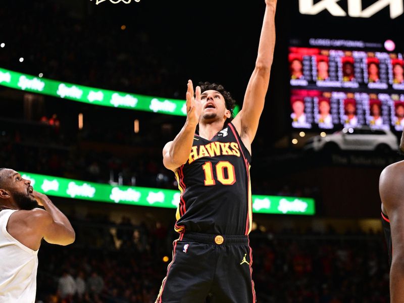 ATLANTA, GA - NOVEMBER 29: Zaccharie Risacher #10 of the Atlanta Hawks drives to the basket during the game against the Cleveland Cavaliers during the Emirates NBA Cup game on November 29, 2024 at State Farm Arena in Atlanta, Georgia.  NOTE TO USER: User expressly acknowledges and agrees that, by downloading and/or using this Photograph, user is consenting to the terms and conditions of the Getty Images License Agreement. Mandatory Copyright Notice: Copyright 2024 NBAE (Photo by Adam Hagy/NBAE via Getty Images)