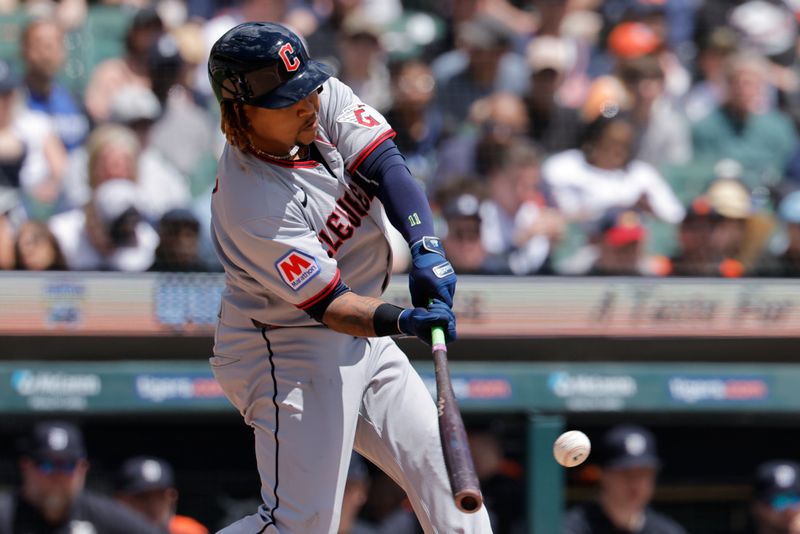 May 25, 2025; Detroit, Michigan, USA;  Cleveland Guardians designated hitter José Ramírez (11) hits a single in the seventh inning against the Detroit Tigers at Comerica Park. Mandatory Credit: Rick Osentoski-Imagn Images