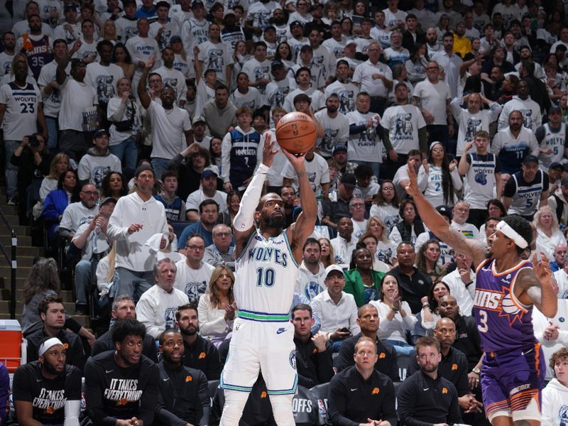 MINNEAPOLIS, MN -  APRIL 23: Mike Conley #10 of the Minnesota Timberwolves shoots a three point basket during the game against the Phoenix Suns during Round One Game Two of the 2024 NBA Playoffs on April 23, 2024 at Target Center in Minneapolis, Minnesota. NOTE TO USER: User expressly acknowledges and agrees that, by downloading and or using this Photograph, user is consenting to the terms and conditions of the Getty Images License Agreement. Mandatory Copyright Notice: Copyright 2024 NBAE (Photo by Jordan Johnson/NBAE via Getty Images)