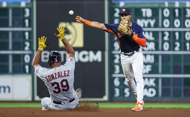 Aug 1, 2023; Houston, Texas, USA; Cleveland Guardians designated hitter Oscar Gonzalez (39) is out at second base as Houston Astros shortstop Jeremy Pena (3) throws to first base to complete a double play during the fifth inning at Minute Maid Park. Mandatory Credit: Troy Taormina-USA TODAY Sports