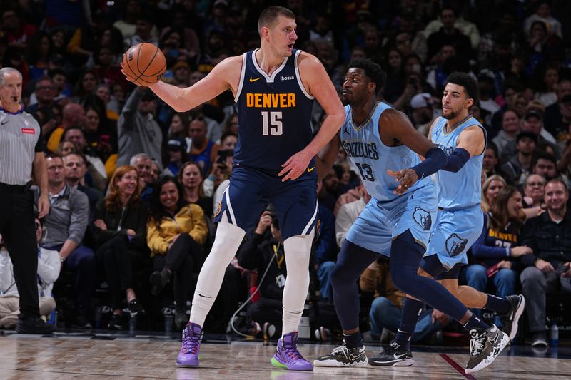 DENVER, CO - MARCH 25:Nikola Jokic #15 of the Denver Nuggets handles the ball during the game against the Memphis Grizzlies on March 25, 2024 at the Ball Arena in Denver, Colorado. NOTE TO USER: User expressly acknowledges and agrees that, by downloading and/or using this Photograph, user is consenting to the terms and conditions of the Getty Images License Agreement. Mandatory Copyright Notice: Copyright 2024 NBAE (Photo by Bart Young/NBAE via Getty Images)