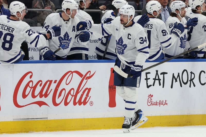 Jan 3, 2026; Elmont, New York, USA; Toronto Maple Leafs center Auston Matthews (34) celebrates after scoring a goal against the New York Islanders during the second period at UBS Arena. Mandatory Credit: Thomas Salus-Imagn Images