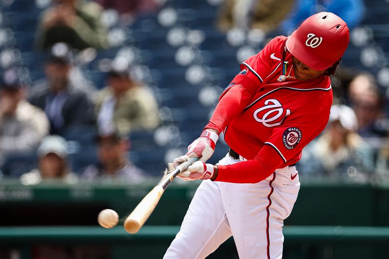 Mar 28, 2023; Washington, District of Columbia, USA; Washington Nationals shortstop CJ Abrams (5) breaks a bat against the New York Yankees during the second inning of the Spring Training game at Nationals Park. Mandatory Credit: Scott Taetsch-USA TODAY Sports