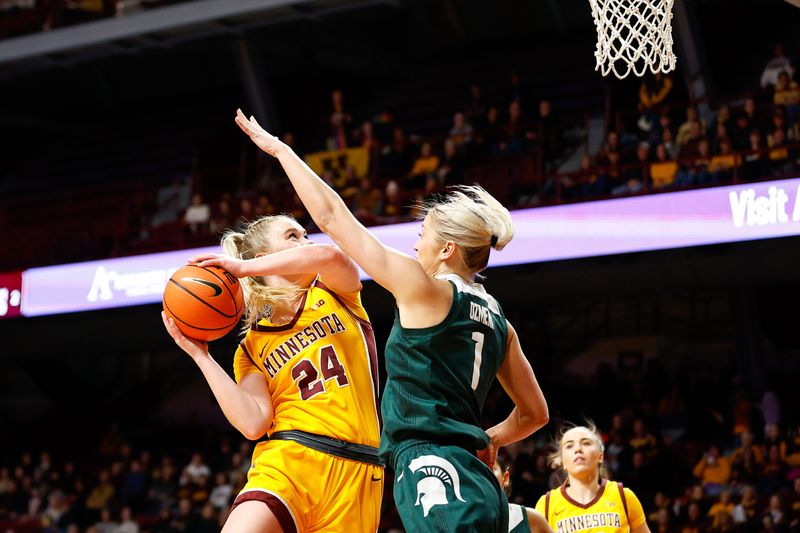 Jan 20, 2024; Minneapolis, Minnesota, USA; Minnesota Golden Gophers forward Mallory Heyer (24) shoots as Michigan State Spartans guard Tory Ozment (1) defends during the first half at Williams Arena. Mandatory Credit: Matt Krohn-USA TODAY Sports