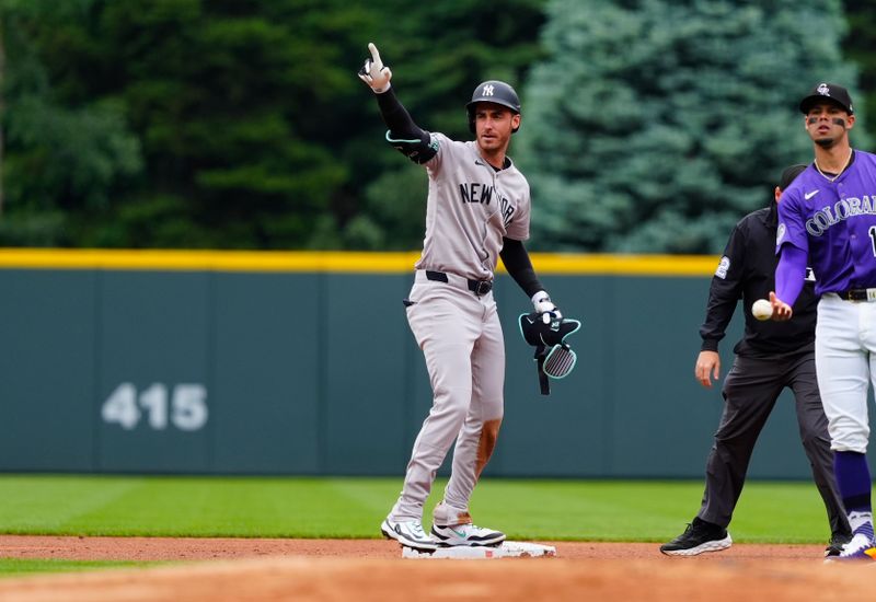 May 24, 2025; Denver, Colorado, USA; New York Yankees left fielder Cody Bellinger (35) reacts following his double in the first inning against the Colorado Rockies at Coors Field. Mandatory Credit: Ron Chenoy-Imagn Images