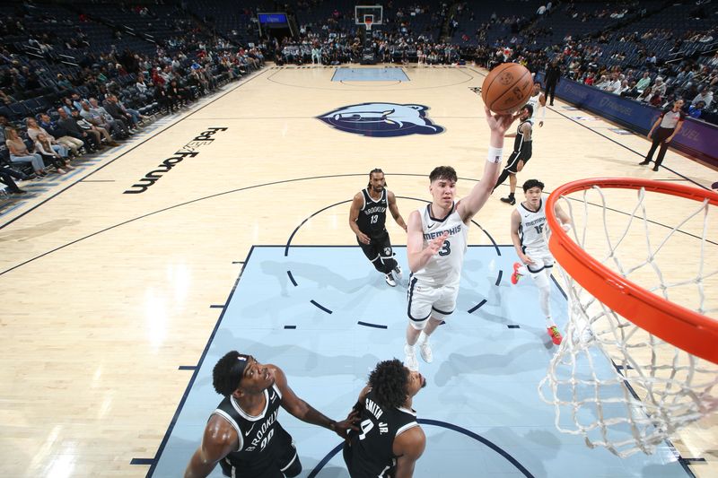 MEMPHIS, TN - February 26:  Jake LaRavia #3 of the Memphis Grizzlies drives to the basket during the game against the Brooklyn Nets on February 26, 2024 at FedExForum in Memphis, Tennessee. NOTE TO USER: User expressly acknowledges and agrees that, by downloading and or using this photograph, User is consenting to the terms and conditions of the Getty Images License Agreement. Mandatory Copyright Notice: Copyright 2024 NBAE (Photo by Joe Murphy/NBAE via Getty Images)