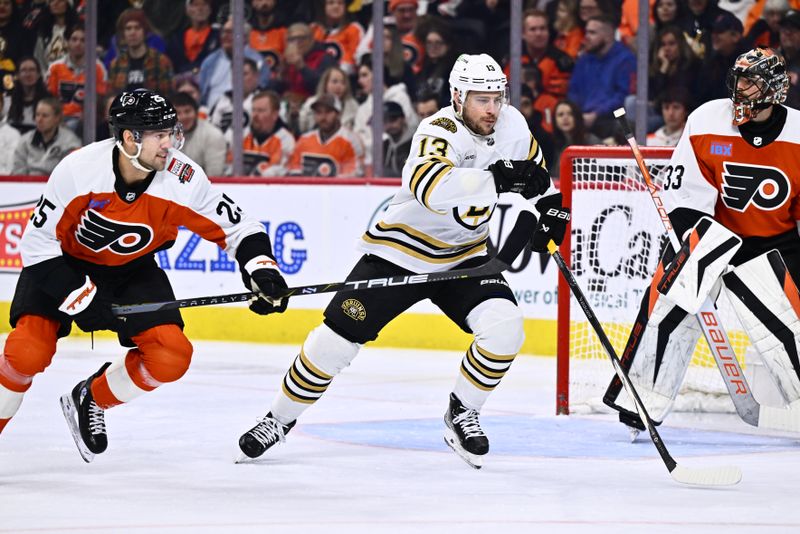 Jan 27, 2024; Philadelphia, Pennsylvania, USA; Boston Bruins center Charlie Coyle (13) chases the puck against Philadelphia Flyers center Ryan Poehling (25) in the first period at Wells Fargo Center. Mandatory Credit: Kyle Ross-USA TODAY Sports