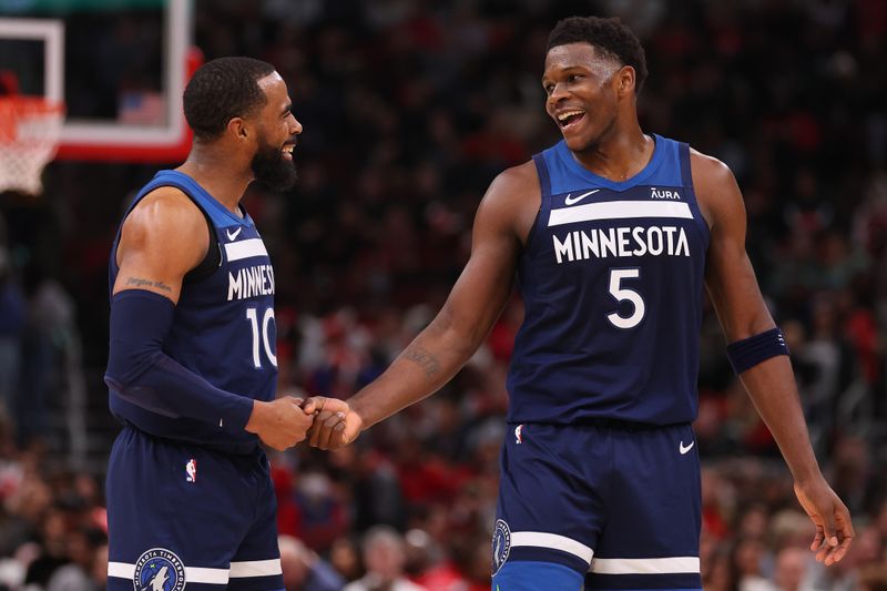 CHICAGO, ILLINOIS - FEBRUARY 06: Mike Conley #10 and Anthony Edwards #5 of the Minnesota Timberwolves celebrate against the Chicago Bulls during the first half at the United Center on February 06, 2024 in Chicago, Illinois. NOTE TO USER: User expressly acknowledges and agrees that, by downloading and or using this photograph, User is consenting to the terms and conditions of the Getty Images License Agreement.  (Photo by Michael Reaves/Getty Images)