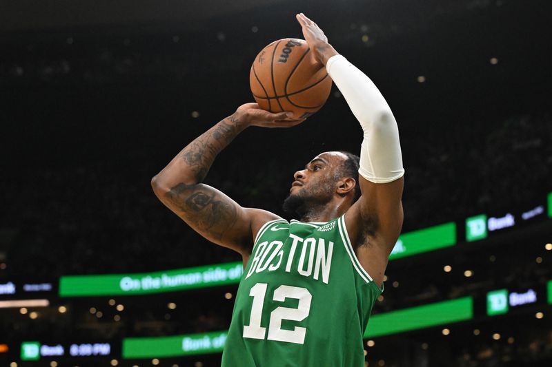 BOSTON, MASSACHUSETTS - APRIL 12: Oshae Brissett #12 of the Boston Celtics attempts a three-point basket against the Charlotte Hornets during the second quarter at the TD Garden on April 12, 2024 in Boston, Massachusetts. NOTE TO USER: User expressly acknowledges and agrees that, by downloading and or using this photograph, User is consenting to the terms and conditions of the Getty Images License Agreement. (Photo by Brian Fluharty/Getty Images)