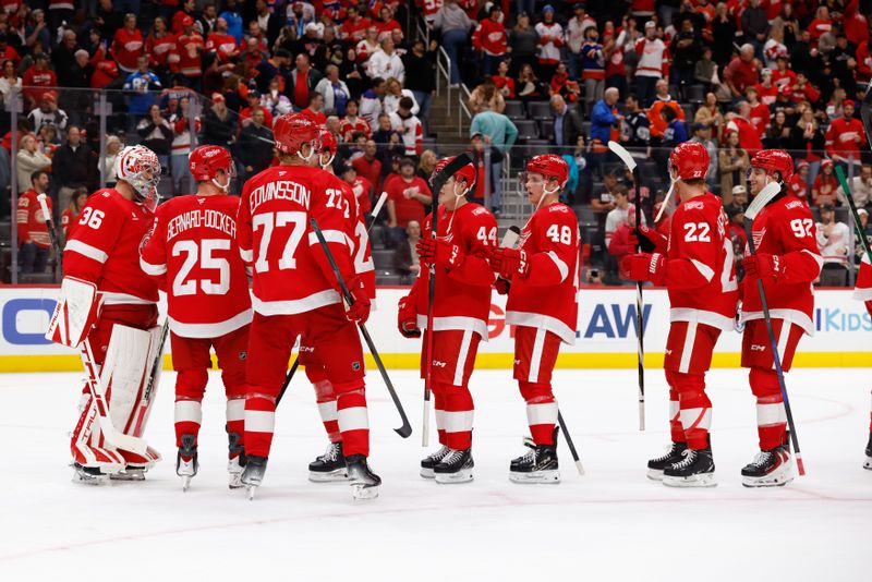 Oct 19, 2025; Detroit, Michigan, USA;  Detroit Red Wings players celebrate on the ice after defeating the Edmonton Oilers at Little Caesars Arena. Mandatory Credit: Rick Osentoski-Imagn Images