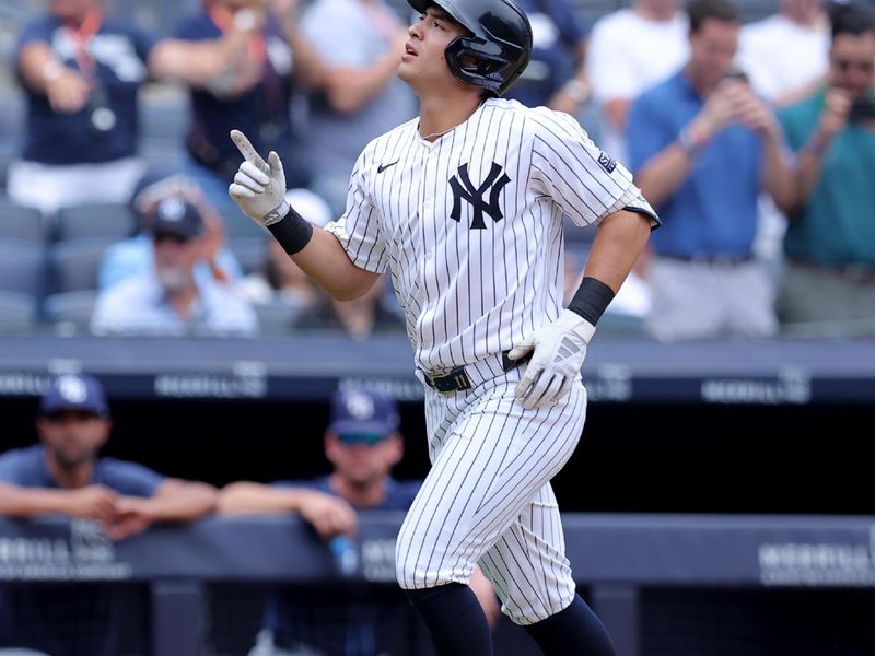 Jul 22, 2024; Bronx, New York, USA; New York Yankees shortstop Anthony Volpe (11) rounds the bases after hitting a solo home run against the Tampa Bay Rays during the second inning at Yankee Stadium. Mandatory Credit: Brad Penner-USA TODAY Sports