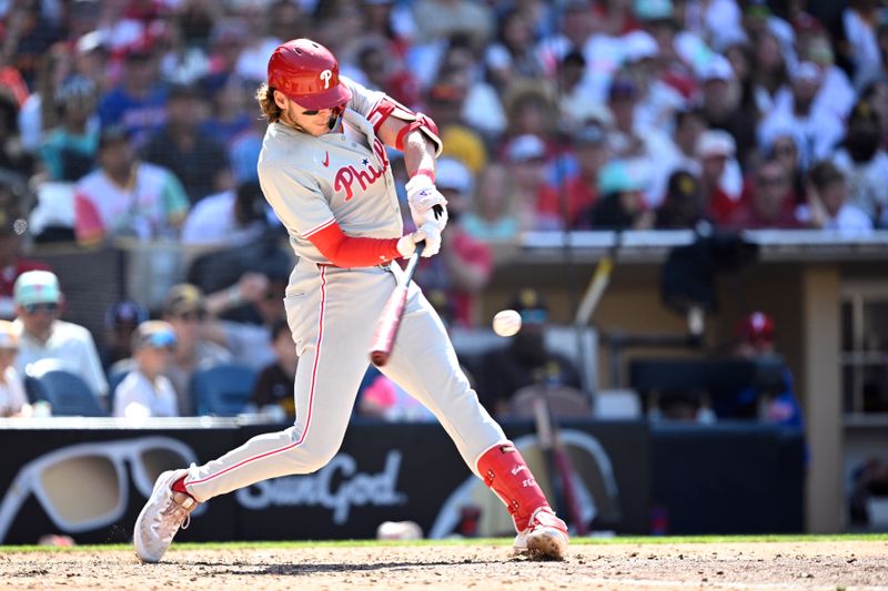 Apr 28, 2024; San Diego, California, USA; Philadelphia Phillies third baseman Alec Bohm (28) hits a double against the San Diego Padres during the ninth inning at Petco Park. Mandatory Credit: Orlando Ramirez-USA TODAY Sports