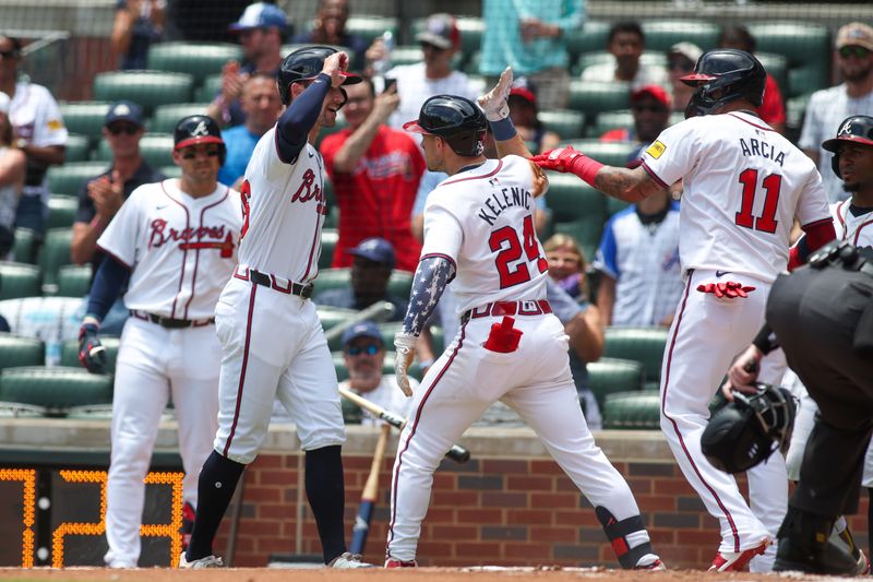 Jul 7, 2024; Atlanta, Georgia, USA; Atlanta Braves center fielder Jarred Kelenic (24) celebrates with left fielder Eli White (36) and shortstop Orlando Arcia (11) after a three-run home run against the Philadelphia Phillies in the second inning at Truist Park. Mandatory Credit: Brett Davis-USA TODAY Sports
