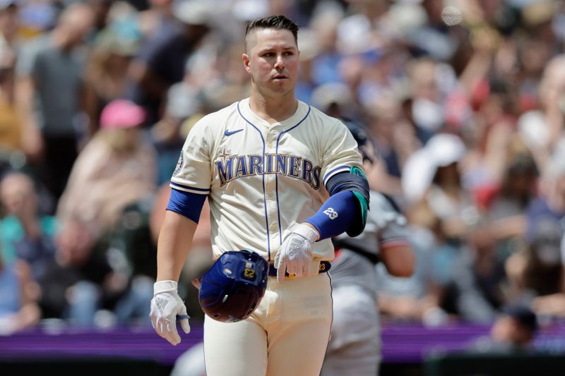Jun 30, 2024; Seattle, Washington, USA; Seattle Mariners first baseman Ty France (23) tosses his helmet after striking out against the Minnesota Twins during the fourth inning at T-Mobile Park. Mandatory Credit: John Froschauer-USA TODAY Sports