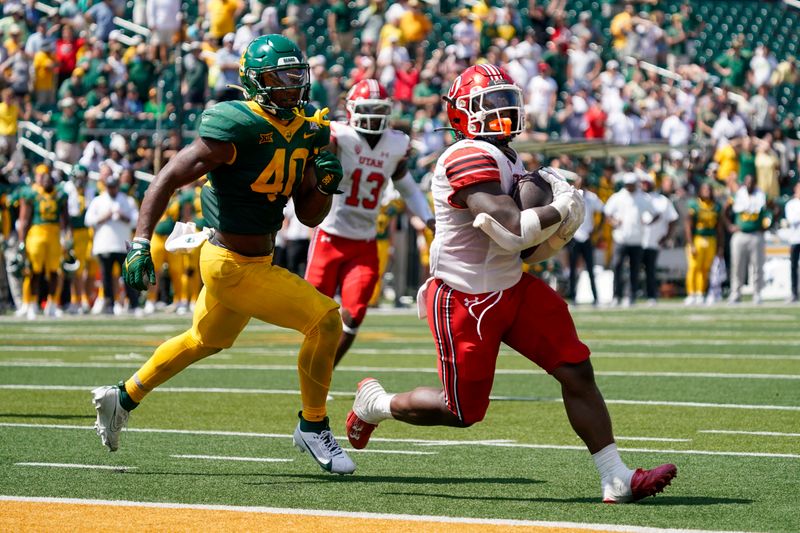 Sep 9, 2023; Waco, Texas, USA; Utah Utes running back Jaylon Glover (1) carries the ball for the game winning past Baylor Bears linebacker Mike Smith Jr. (40) during the second half at McLane Stadium. Mandatory Credit: Raymond Carlin III-USA TODAY Sports