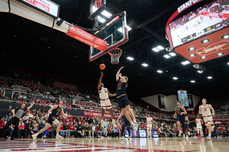 Dec 30, 2025; Stanford, California, USA; Stanford Cardinal forward Chisom Okpara (10) shoots the ball against Notre Dame Fighting Irish forward Garrett Sundra (12) during the second half at Maples Pavilion. Mandatory Credit: Robert Edwards-Imagn Images