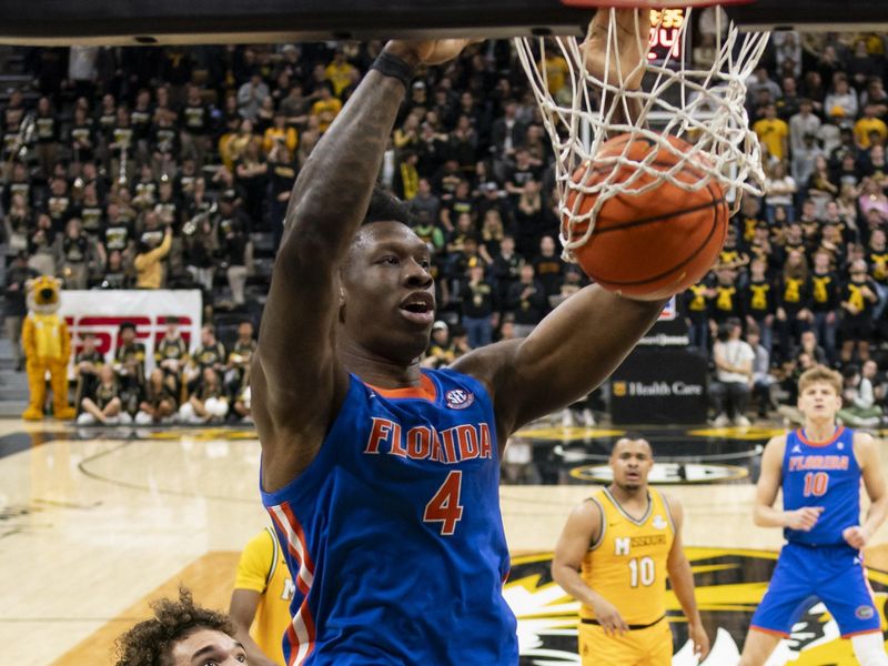 Jan 20, 2024; Columbia, Missouri, USA; Florida Gators forward Tyrese Samuel (4) dunks the ball against Missouri Tigers forward Noah Carter (35) during the first half at Mizzou Arena. Mandatory Credit: Jay Biggerstaff-USA TODAY Sports