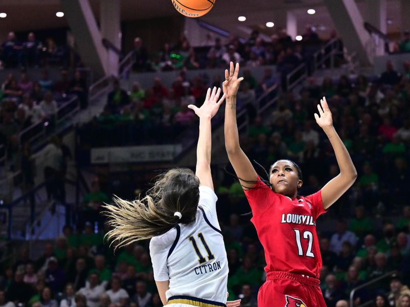 Mar 3, 2024; South Bend, Indiana, USA; Louisville Cardinals guard Kiki Jefferson (12) shoots over Notre Dame Fighting Irish guard Sonia Citron (11) in the first half at the Purcell Pavilion. Mandatory Credit: Matt Cashore-USA TODAY Sports