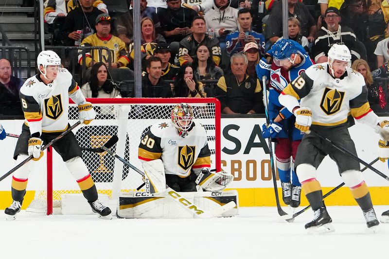 Oct 31, 2025; Las Vegas, Nevada, USA; Vegas Golden Knights goaltender Carl Lindbom (30) makes a save against the Colorado Avalanche during the second period at T-Mobile Arena. Mandatory Credit: Stephen R. Sylvanie-Imagn Images