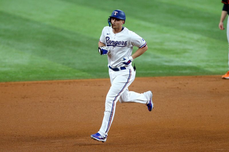 Oct 10, 2023; Arlington, Texas, USA; Texas Rangers shortstop Corey Seager (5) runs after hitting a solo home run against the Baltimore Orioles in the first inning during game three of the ALDS for the 2023 MLB playoffs at Globe Life Field. Mandatory Credit: Andrew Dieb-USA TODAY Sports