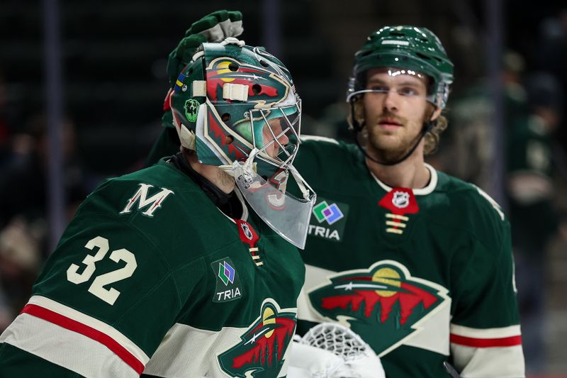 Jan 23, 2025; Saint Paul, Minnesota, USA; Minnesota Wild defenseman Jon Merrill (4) and goaltender Filip Gustavsson (32) react to their teams loss against the Utah Hockey Club after the game at Xcel Energy Center. Mandatory Credit: Matt Krohn-Imagn Images