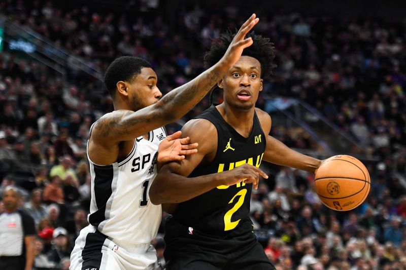 SALT LAKE CITY, UTAH - MARCH 27: Blake Wesley #14 of the San Antonio Spurs defends Collin Sexton #2 of the Utah Jazz during the second half of a game at Delta Center on March 27, 2024 in Salt Lake City, Utah. NOTE TO USER: User expressly acknowledges and agrees that, by downloading and or using this photograph, User is consenting to the terms and conditions of the Getty Images License Agreement. (Photo by Alex Goodlett/Getty Images)