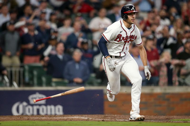 Oct 12, 2022; Atlanta, Georgia, USA; Atlanta Braves first baseman Matt Olson (28) watches his RBI single against the Philadelphia Phillies in the sixth inning during game two of the NLDS for the 2022 MLB Playoffs at Truist Park. Mandatory Credit: Brett Davis-USA TODAY Sports