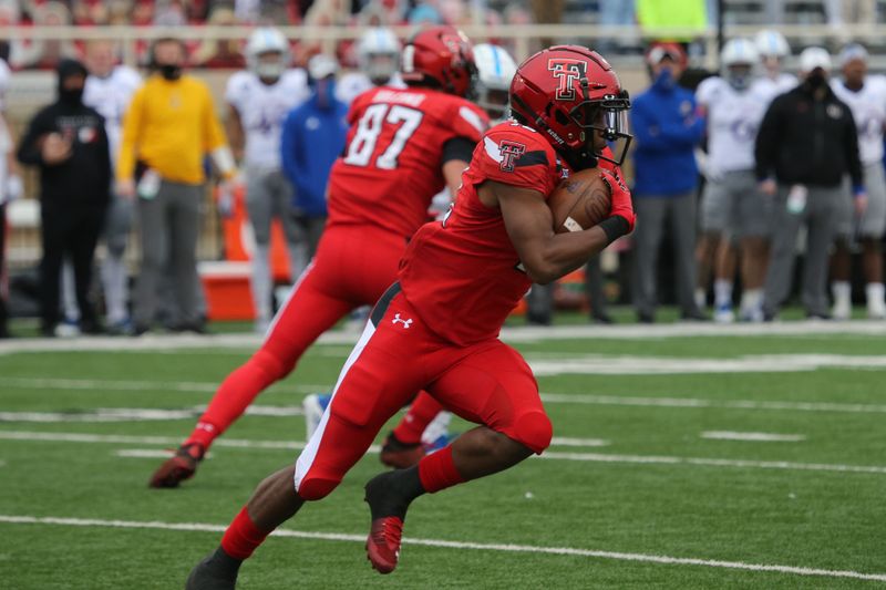 Dec 5, 2020; Lubbock, Texas, USA;  Texas Tech Red Raiders wide receiver Miles Price (18) rushes against the Kansas Jayhawks in the first half at Jones AT&T Stadium. Mandatory Credit: Michael C. Johnson-USA TODAY Sports