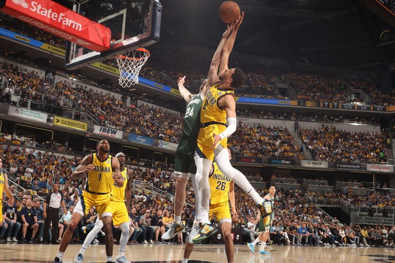 INDIANAPOLIS, IN - APRIL 28: Tyrese Haliburton #0 of the Indiana Pacers goes up for the rebound during the game against the Milwaukee Bucks during Round 1 Game 4 of the 2024 NBA Playoffs on April 28, 2024 at Gainbridge Fieldhouse in Indianapolis, Indiana. NOTE TO USER: User expressly acknowledges and agrees that, by downloading and or using this Photograph, user is consenting to the terms and conditions of the Getty Images License Agreement. Mandatory Copyright Notice: Copyright 2024 NBAE (Photo by Nathaniel S. Butler/NBAE via Getty Images)