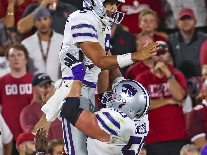 Sep 24, 2022; Norman, Oklahoma, USA;  Kansas State Wildcats quarterback Adrian Martinez (9) celebrates with offensive lineman Cooper Beebe (50) after scoring a touchdown during the second half against the Oklahoma Sooners at Gaylord Family-Oklahoma Memorial Stadium. Mandatory Credit: Kevin Jairaj-USA TODAY Sports