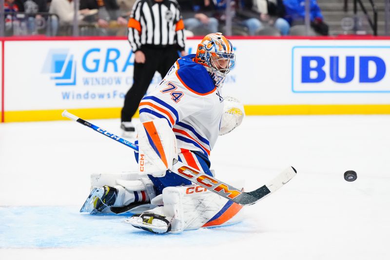 Nov 30, 2024; Denver, Colorado, USA; Edmonton Oilers goaltender Stuart Skinner (74) makes a stick save in the second period against the Colorado Avalanche at Ball Arena. Mandatory Credit: Ron Chenoy-Imagn Images