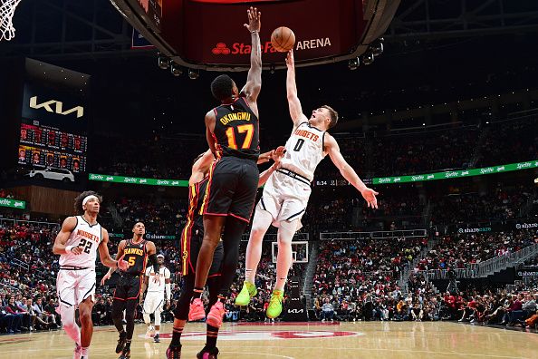 ATLANTA, GA - DECEMBER 11: Christian Braun #0 of the Denver Nuggets shoots the ball during the game against the Atlanta Hawks on December 11, 2023 at State Farm Arena in Atlanta, Georgia.  NOTE TO USER: User expressly acknowledges and agrees that, by downloading and/or using this Photograph, user is consenting to the terms and conditions of the Getty Images License Agreement. Mandatory Copyright Notice: Copyright 2023 NBAE (Photo by Scott Cunningham/NBAE via Getty Images)