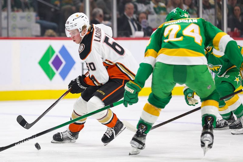 sJan 27, 2024; Saint Paul, Minnesota, USA; Anaheim Ducks defenseman Jackson LaCombe (60) skates with the puck as Minnesota Wild defenseman Zach Bogosian (24) defends during the first period at Xcel Energy Center. Mandatory Credit: Matt Krohn-USA TODAY Sports