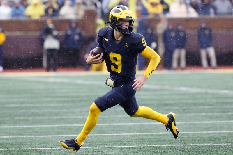 Oct 14, 2023; Ann Arbor, Michigan, USA; Michigan Wolverines quarterback J.J. McCarthy (9) rushes in the second half against the Indiana Hoosiers at Michigan Stadium. Mandatory Credit: Rick Osentoski-USA TODAY Sports