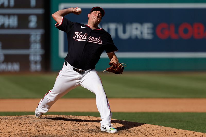 Jun 19, 2024; Washington, District of Columbia, USA; Washington Nationals pitcher Derek Law (58) pitches against the Arizona Diamondbacks during the seventh inning at Nationals Park. Mandatory Credit: Geoff Burke-USA TODAY Sports