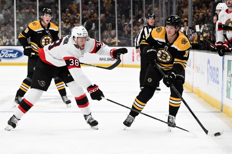 Nov 9, 2024; Boston, Massachusetts, USA; Boston Bruins center Trent Frederic (11) passes the puck around Ottawa Senators center Zack Ostapchuk (38) during the first period at TD Garden. Mandatory Credit: Brian Fluharty-Imagn Images